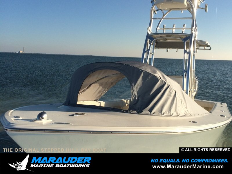Photo of boat with front tent cover protection in Stepped Hull Bay Boats photo gallery from Marauder Marine Boat Works